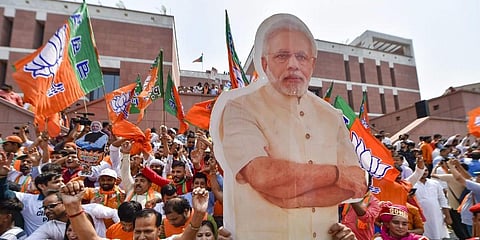 BJP supporters carry a cut-out of PM Narendra Modi. (File Photo | PTI)