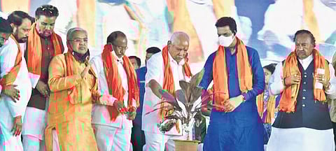 Chief Minister BS Yediyurappa and BJP state unit president Nailn Kumar Kateel (second from right) launch the party bypoll campaign at Maski on Saturday