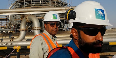 Engineers walk in front of an oil separator at a Saudi Aramco processing facility in Abqaiq, Saudi Arabia. (Photo | AP)