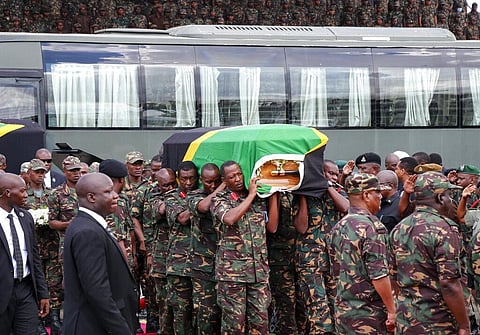 Members of the military carry the body of former president John Magufuli to lie in state at Uhuru stadium in Dar es Salaam, Tanzania (Photo | AP)
