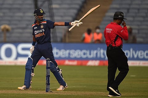 India's Krunal Pandya celebrates after scoring a half-century during the first ODI match against England at the Maharashtra Cricket Association Stadium in Pune on March 23, 2021. (Photo | AFP)