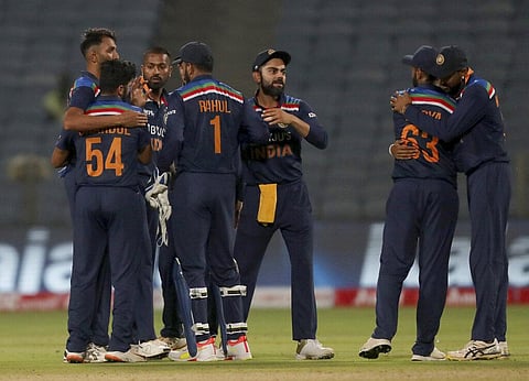 India's captain Virat Kohli, third right, and teammates celebrate their win in the first ODI at Pune. (Photo | AP)