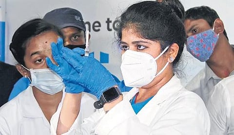 A doctor loads Covid vaccine into a syringe at a private hospital in Hyderabad | Vani Buddhavarapu