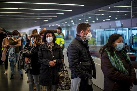 People queue after receiving the COVID-19 vaccine, during a mass vaccination campaign at Wanda Metropolitano stadium in Madrid, Spain (Photo | AP)