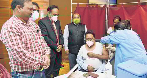 Krishna district collector A Md Imtiaz launches vaccination drive for airport staff  at the Vijayawada International Airport on Tuesday. (Photo| EPS)