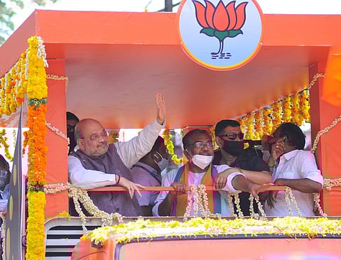 Union Home Minister Amit Shah participating in the road show in Tripunithura as part of the election campaign of BJP candidate K S Radhakrishnan (Photo | A Sanesh)