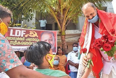 A child greets LDF candidate C K Hareendran before he sets out for his road show at Parassala as part of electioneering | B P Deepu