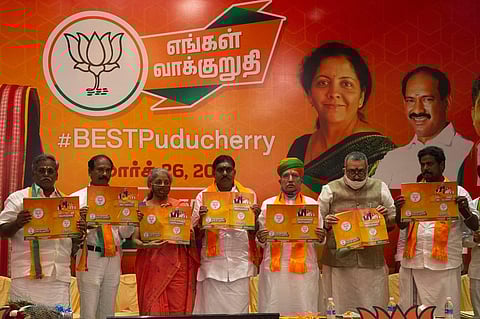 Union Finance Minister Nirmala Sitharaman releasing the BJP manifesto for Puducherry on Thursday (Photo | G Pattabi Raman, EPS)