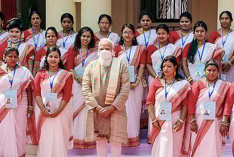 Prime Minister Narendra Modi in a group photo during his visit to the Jeshoreshwari Kali Temple, in Satkhira, Bangladesh. (Photo | PTI)