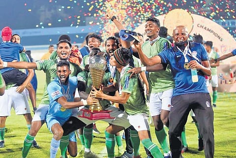 Players of Gokulam Kerala FC are all joy as they celebrate with the trophy after winning the I-League in Kolkata on Saturday
