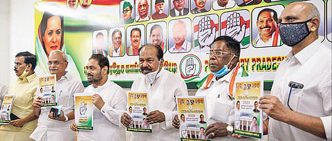 Congress leader V Narayansamy, Veerappa Moily and others launching the manifesto. (Photo | G Pattabai Raman)