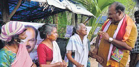NDA candidate Thazhava Sahadevan interacts with elderly people during his campaign at Panayam. (Photo | Vincent Pulickal, EPS)