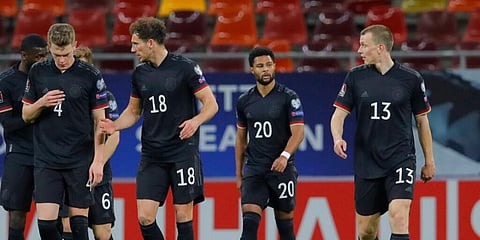 Germany's Serge Gnabry (SR) with teammates after scoring the opening goal during the World Cup 2022 group J qualifying match against Romania. (Photo | AP)