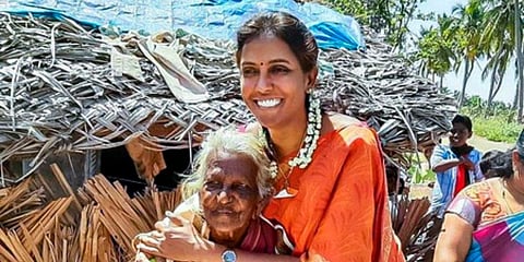 Congress MP Jothimani seen with an elderly woman in Karur. (Photo| EPS)