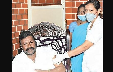 Agriculture Minister B C Patil gets vaccinated at his residence in Hirekerur, Haveri, on Tuesday | Express