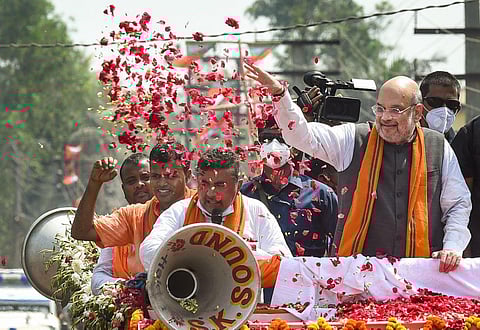 Union Home Minister Amit Shah during an election campaign roadshow in support of BJP candidate Suvendu Adhikari from Nandigram constituency. (Photo | PTI)