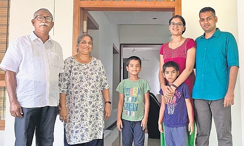 Aaron Varghese (right) with his family