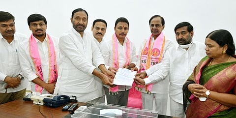 Telangana CM K Chandrasekhar Rao gives the B-form to Nomula Bhagath. (Photo| EPS)