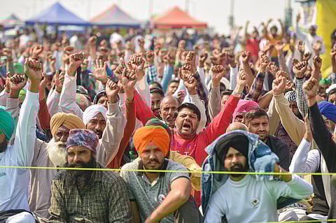 Farmers raise slogans during their protest against new farm laws at Ghazipur border in New Delhi. (File Photo | PTI)