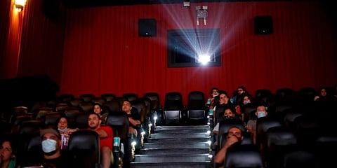 People watch a movie at a cinema after almost a year of theaters being closed due to the COVID-19 pandemic, in Buenos Aires, Argentina. (Photo | AP)