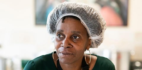 Chief coordinator Glenda Andrew poses for a photo as she prepares West Indian meals with members of the Preston Windrush COVID Response team, at the Xaverian Sanctuary, in Preston. (Photo | AP)