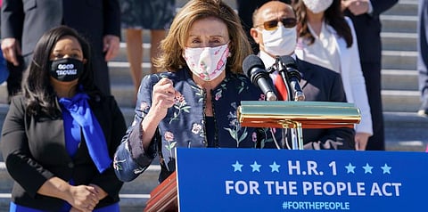 Speaker of the House Nancy Pelosi, D-Calif., and the Democratic Caucus gather to address reporters on H.R. 1, the For the People Act of 2021, at the Capitol in Washington. (Photo | AP)