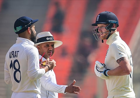 On-field umpire Nitin Menon intervenes as Indian skipper Virat Kohli and England all-rounder engage in an argument. (Photo | PTI)