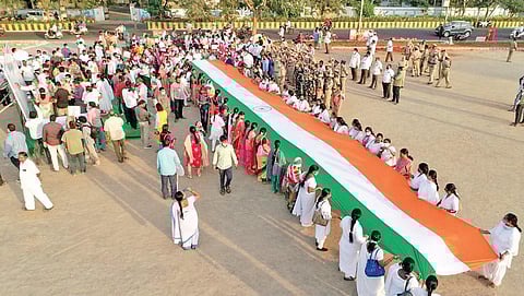 Election officials organise an awareness rally urging people to exercise their franchise in the municipal elections in Vijayawada on Thursday I Express