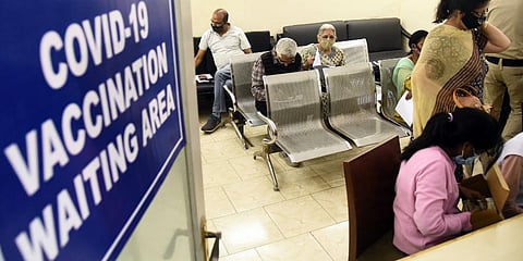 Senior citizens waiting to register their names for the COVID-19 vaccination at the Sanjeevan Hospital in New Delhi on Friday. (Photo | Parveen Negi, EPS)