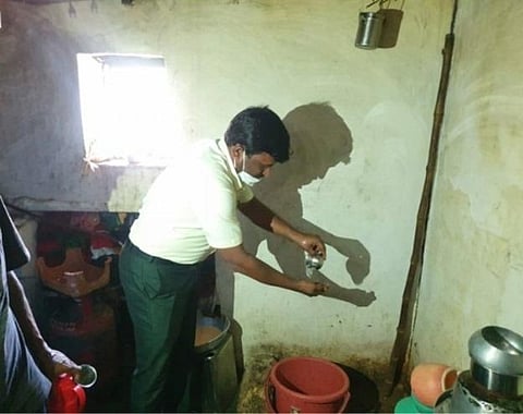 A video clip showing tahsildar Ashappa Pujar washing a tea cup at a hotel in Horogeri village in Gadag district 