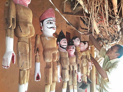 Susant preparing puppets in his house at Rahidhi village in Dhenkanal | Express