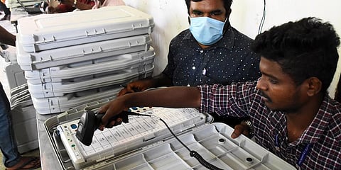 EVM Machine is scanned by officials. (Photo | U Rakesh Kumar, EPS)
