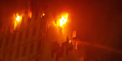 Fire breaks out at the 13th floor of a multi-storeyed building in Kolkata, Monday, March 8, 2021. (Photo | PTI)