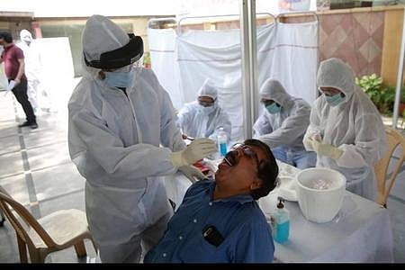 A healthcare worker takes a swab sample for COVID-19 test. (Photo | Express)