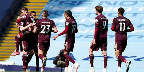 Leeds United's Stuart Dallas, left, is congratulated by teammates after scoring against City. (Photo | AP)