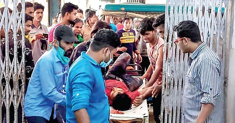 A man injured in clashes during the fourth phase of Bengal elections  in Cooch Behar is brought to a hospital on Saturday. (Photo | PTI)