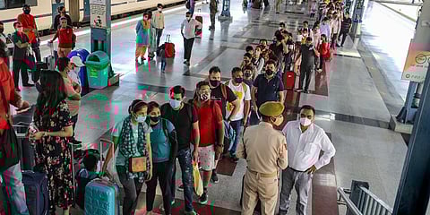 Pilgrims wait to be tested for COVID-19 after arriving in Katra to visit the Mata Vaishno Devi shrine. (Photo | ANI)