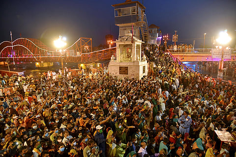 Devotees gather to offer prayers during Ganga aarti at Kumbh Mela, at Har ki Pouri, in Haridwar. (Photo | PTI)