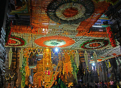 The temple flag marking the beginning of Chithirai Festival is being hoisted by the priests at the Meenakshi Sundareswarar temple. (File photo | EPS)