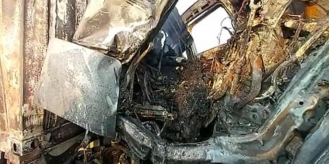 Charred remains of the container truck that caught fire in Hyderabad on Thursday morning. (Photo | Screengrab)
