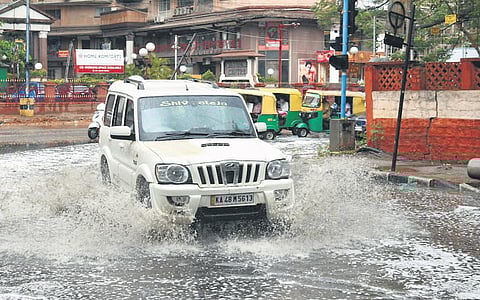 An SUV ploughs through a waterlogged stretch on Cubbon Road, in Bengaluru on Wednesday | MEGHANA SASTRY