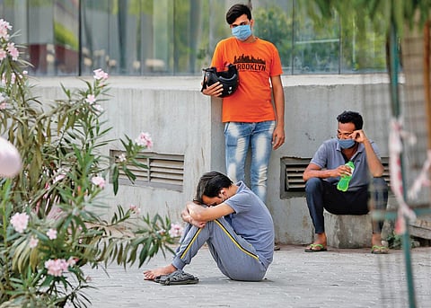A distraught man outside the mortuary of a hospital in Ahmedabad | PTI