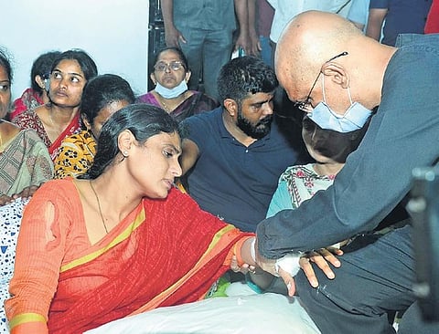 YS Sharmila being administered first aid after she suffered injuries to her hand in an altercation with the police on her way to her Lotus Pond residence from Indira Park, in Hyderabad on Thursday.