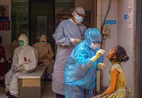Medics check patients at a clinic who are having cold and cough in the wake of coronavirus pandemic. (File Photo | PTI)