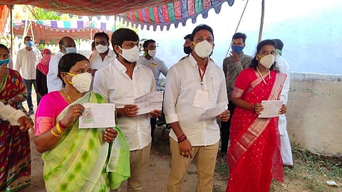 TRS candidate Nomula Bhagath and his family members exercising their franchise at a polling booth in Ibrahimpet in Anumula mandal in Nalgonda district in Telangana. (Photo | EPS)
