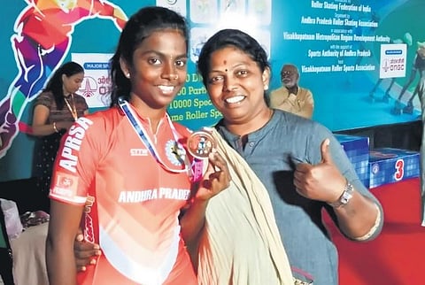 Guna Pravallika with her mother after her win at a national-level skating contest.