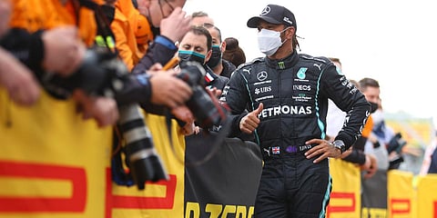Second-placed Lewis Hamilton celebrates with teammates at the end of the Emilia Romagna Formula One Grand Prix in Inola, Italy. (Photo| AP)
