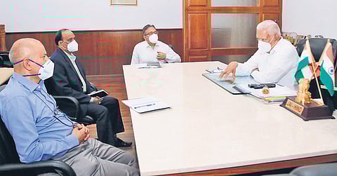 Governor Vajubhai Vala interacts with officials on effective handling the surge in Covid cases, on Sunday | Express