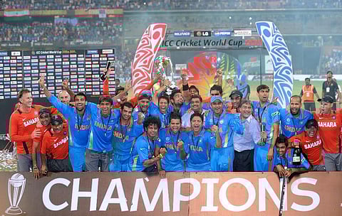 Indian cricketers pose with the trophy as they celebrate after beating Sri Lanka in the ICC Cricket World Cup 2011 final match at The Wankhede Stadium in Mumbai. (Photo | AFP)