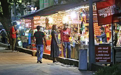 Though the government has introduced stricter norms to curb Covid spread, several shops continue to function till night.  A scene from Marine Drive | Arun Angela